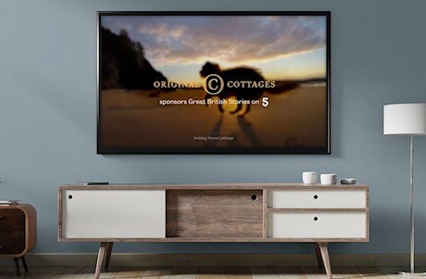 Wall mounted Tv with original cottages logo displayed
