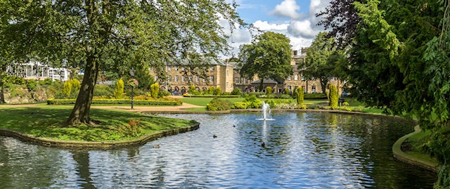 Pond with small fountain at the Pavillion Gardens in Buxton