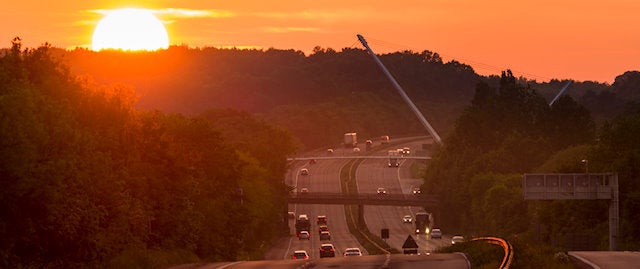 Busy motorway at sunset