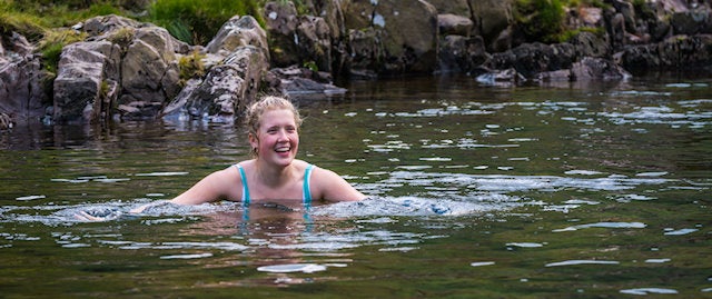 Woman wild swimming 