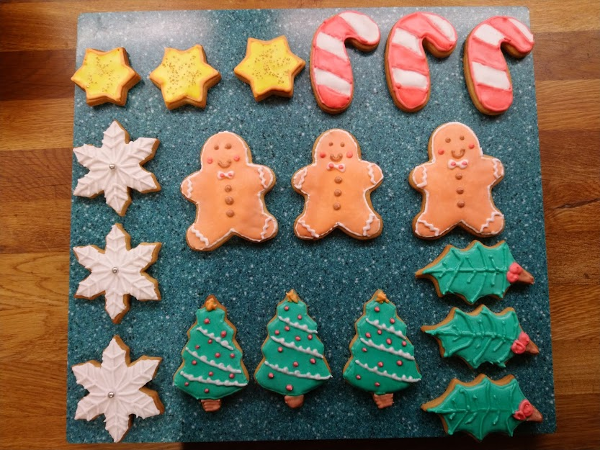 Biscuits baked, iced and neatly arranged in trios ready to eat!