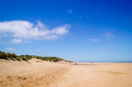 North Norfolk Coast Sunny blue skies above a sandy beach on the Norfolk coast