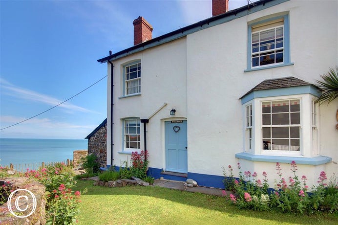 Perched on the cliff top overlooking the Atlantic Ocean stretching from Hartland to Baggy Point with Lundy Island on the horizon