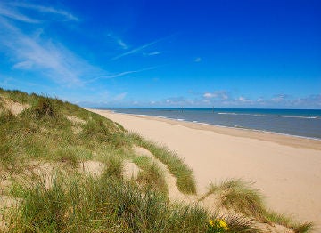 The fine pale sands and dunes of Norfolk's coastline are worth visiting