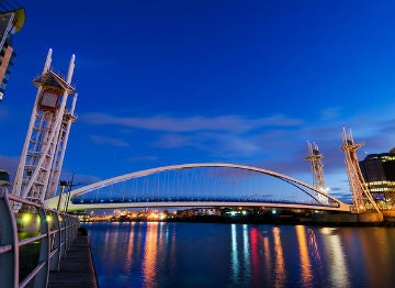 The Millennium bridge at night in the city of Manchester 